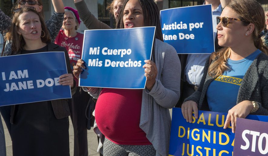 Activists with Planned Parenthood demonstrate in support of a pregnant 17-year-old being held in a Texas facility for unaccompanied immigrant children to obtain an abortion, outside of the Department of Health and Human Services in Washington. (AP Photo/J. Scott Applewhite File)