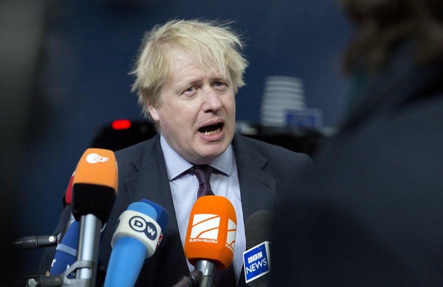 British Foreign Secretary Boris Johnson speaks with the media as he arrives for a meeting of EU foreign ministers at the Europa building in Brussels on Monday, March 19, 2018. European Union foreign ministers on Monday are set to discuss Ukraine, Syria, Korea and Iran. (AP Photo/Virginia Mayo)