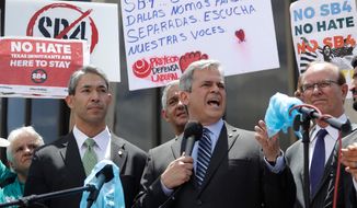 FILE - In this Monday, June 26, 2017 file photo, Austin, Texas Mayor Steve Adler, center, stands with San Antonio Mayor Ron Nirenberg, left, as he speaks to protesters at a rally in San Antonio outside of the Federal Courthouse to oppose a new Texas &amp;quot;sanctuary cities&amp;quot; bill that aligns with the president&#39;s tougher stance on illegal immigration. The census, undertaken every 10 years, uses the number of total residents _ not citizens _ to allot seats in the U.S. House of Representatives to each state. &amp;quot;If we don&#39;t count all the people who live in our city _ all the residents we have _ it could mean that our community doesn&#39;t get our fair share of moneys or aid,” says Adler. (AP Photo/Eric Gay)
