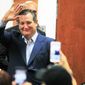 FILE - In this April 2, 2018, file photo, U.S. Senator Ted Cruz, R-Texas, waves to supporters as he enters the room while campaigning for re-election at the National Border Patrol Council Local 3307 offices in Edinburg, Texas.  The Texan is seeking re-election to the U.S. Senate by pledging to repeal Barack Obama’s signature health care law, abolish the IRS and beat back federal overreach, even though the Trump administration has already diluted the health law, delivered sweeping tax cuts and code revisions and controls Washington along with a Republican-led Congress. (Joel Martinez/The Monitor via AP, File)