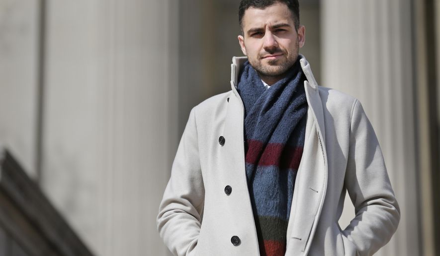 In this April 2, 2018 photo, Qutaiba Idlbi poses for a picture at Columbia University in New York where he is a sophomore. A scholarship program that Columbia created to support Syrians who, like Idlbi, were displaced by war, could be jeopardized by the travel restrictions that President Trump has imposed on citizens of that country. (AP Photo/Seth Wenig)