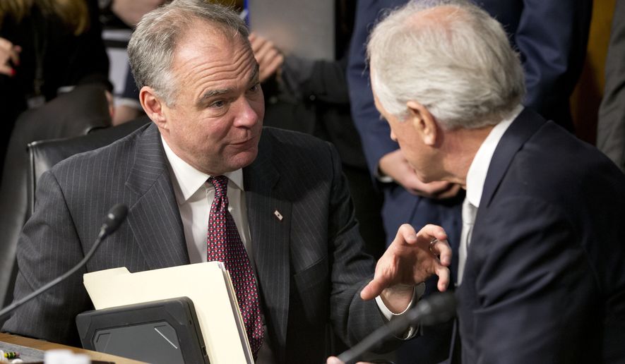 Senate Foreign Relations Committee Chairman Sen. Bob Corker, R-Tenn., right, confers with committee member Sen. Tim Kaine, D-Va. on Capitol Hill in Washington, Wednesday, Jan. 11, 2017, during a break in the committee&#39;s confirmation hearing for Secretary of State-designate Rex Tillerson.  (AP Photo/Steve Helber)