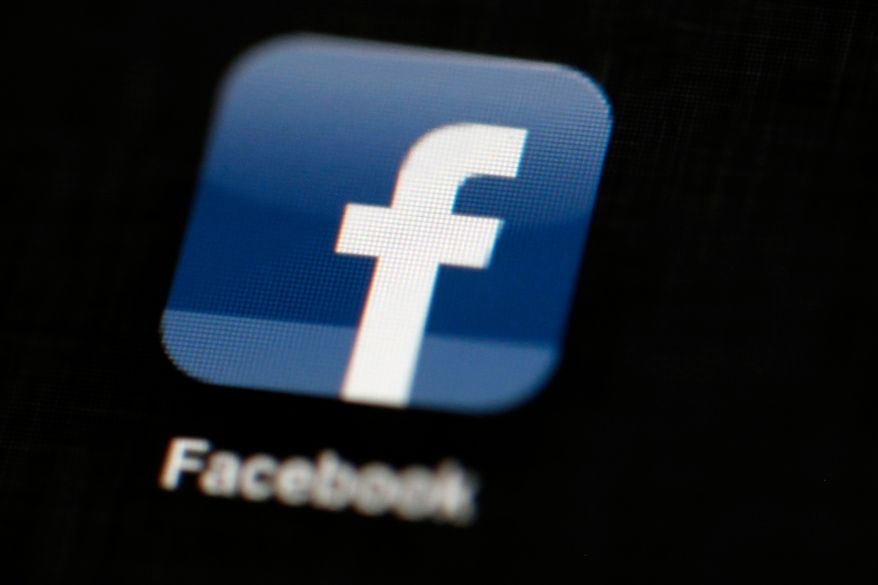 FILE - In this May 16, 2012, file photo, the Facebook logo is displayed on an iPad in Philadelphia. A propaganda expert who has studied Cambridge Analytica says the company helped Donald Trumps presidential campaign use false statements and anti-Muslim messages to spread fear and resentment in swing states he needed to win. Cambridge Analytica did not immediately respond to an email seeking comment from The Associated Press on the submission. However, it has denied it used the data scraped from an app that obtained material from Facebook users in the Trump campaign. (AP Photo/Matt Rourke, File)