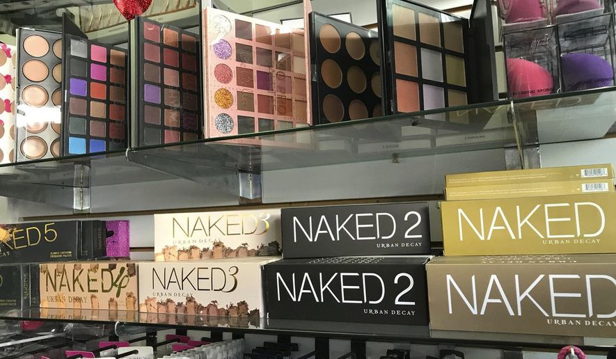 This April 12, 2018, photo released by the Los Angeles Police Department shows counterfeit cosmetics to be seized by police in the Santee Alley area of Los Angeles. $700,000 worth of counterfeit cosmetics seized from vendors in downtown's fashion district have tested positive for bacteria, lead and traces of animal feces, Los Angeles police said Monday, April 16, 2018. (Cpt. Marc Reina/Los Angeles Police Department via AP)