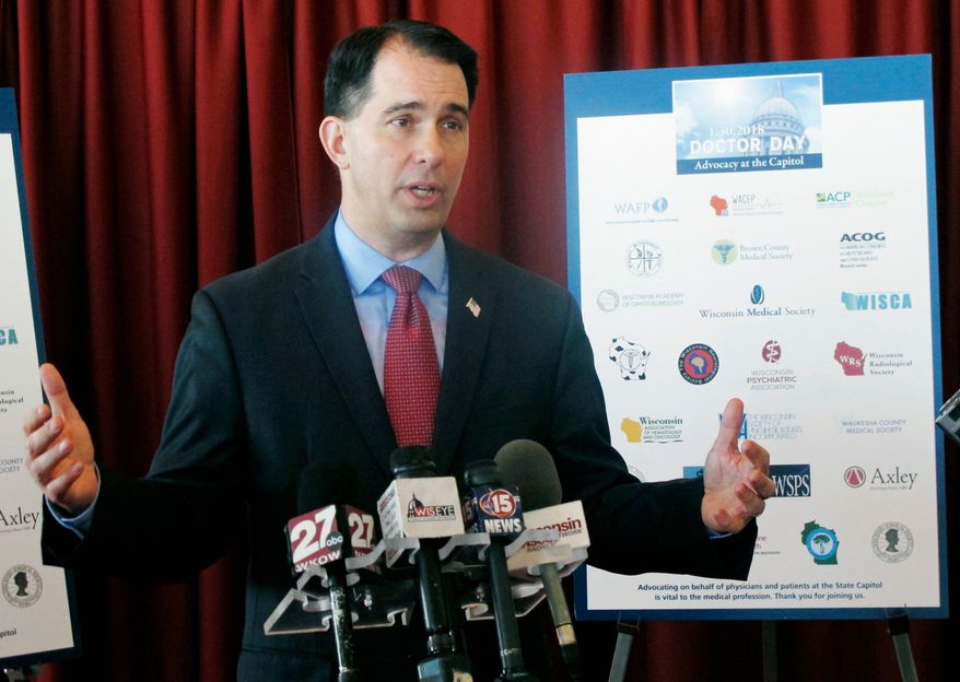 FILE - In this Jan. 30, 2018, file photo, Wisconsin Gov. Scott Walker speaks at a news conference in Madison, Wis. The Republican Governors Association announced Monday, April 9, 2018, it has booked $5.1 million worth of television advertising time in Wisconsin for the five weeks leading up to the Nov. 6 election. Walker is running for a third term this year. (AP Photo/Scott Bauer, File)