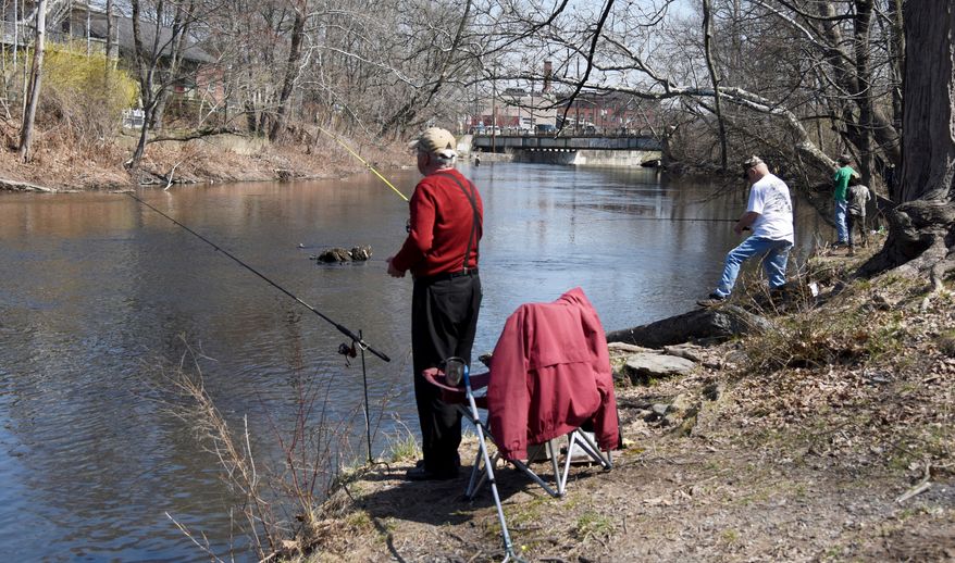 In this Saturday, April 14, 2018 photo, fishermen cast lines along McMichael Creek in Stroudsburg, Pa., during Pennsylvania's statewide opening day of trout season. In 2018, Pennsylvania is stocking streams with more than 2.5 million trout, and lakes are receiving 624,700 trout. Combine this with the more than 1.2 million trout from cooperative fisheries, and around 4.4 million trout have been stocked into Pennsylvania waterways. (Patrick Campbell/Pocono Record via AP)