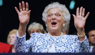 FILE - In this Aug. 18, 1992, file photo, first lady Barbara Bush reacts to Sen. Phil Gramm, who delivered the keynote address to the Republican National Convention at the Houston Astrodome. A family spokesman said Tuesday, April 17, 2018, that former first lady Barbara Bush has died at the age of 92. (AP Photo/Marcy Nighswander, File)