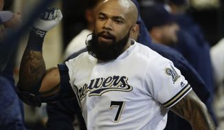 Milwaukee Brewers&#39; Eric Thames celebrates his two-run home run during the sixth inning of a baseball game against the Cincinnati Reds Tuesday, April 17, 2018, in Milwaukee. (AP Photo/Morry Gash)