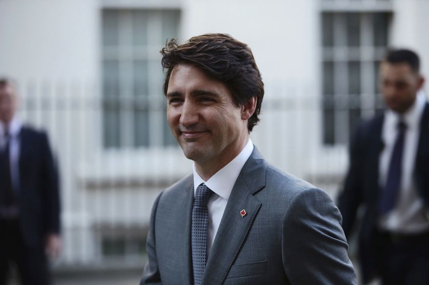 In this file photo, Canada&#39;s Prime Minister Justin Trudeau smiles as he leaves Downing Street after bilateral talks with Britain&#39;s Theresa May, in London, Wednesday, April 18, 2018. (Jack Taylor/Pool Photo via AP) ** FILE **