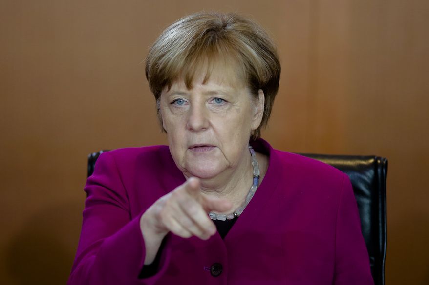 German Chancellor Angela Merkel leads the weekly Cabinet meeting of the German government at the chancellery in Berlin, Wednesday, April 18, 2018. (AP Photo/Markus Schreiber)