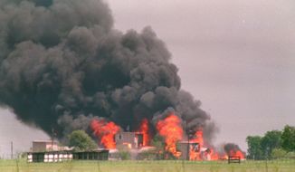 FILE - In this April 19, 1993 file photo, flames engulf the Branch Davidian compound in Waco, Texas. Doomsday cult leader David Koresh&#39;s apocalyptic vision came true when the fire believed set by his followers destroyed their prairie compound as federal agents tried to drive them out with tear gas after a 51-day standoff. As many as 86 members of the Branch Davidian religious sect, including Koresh and 24 children, were thought to have died as the flames raced through the wooden buildings in 30 minutes. Only nine were known to have survived. (AP Photo/Susan Weems, File)
