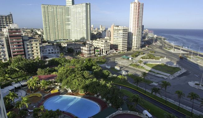 FILE - This Jan. 2, 2007 file photo shows the Miramar section of Havana, Cuba.  In 2008, the government lifted its prohibition on Cubans staying at the island’s resort hotels. (AP Photo/Mike Stewart, File)