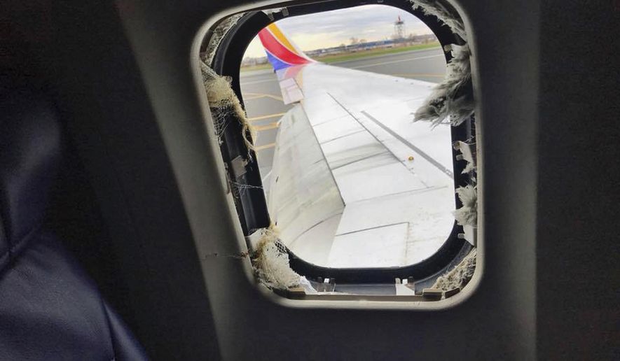 This April 17, 2018 photo provided by Marty Martinez shows the window that was shattered after a jet engine of a Southwest Airlines airplane blew out at altitude, resulting in the death of a woman who was nearly sucked from the window during the flight of the Boeing 737 bound from New York to Dallas with 149 people aboard, shown after it made an emergency landing in Philadelphia. (Marty Martinez via AP) **FILE**