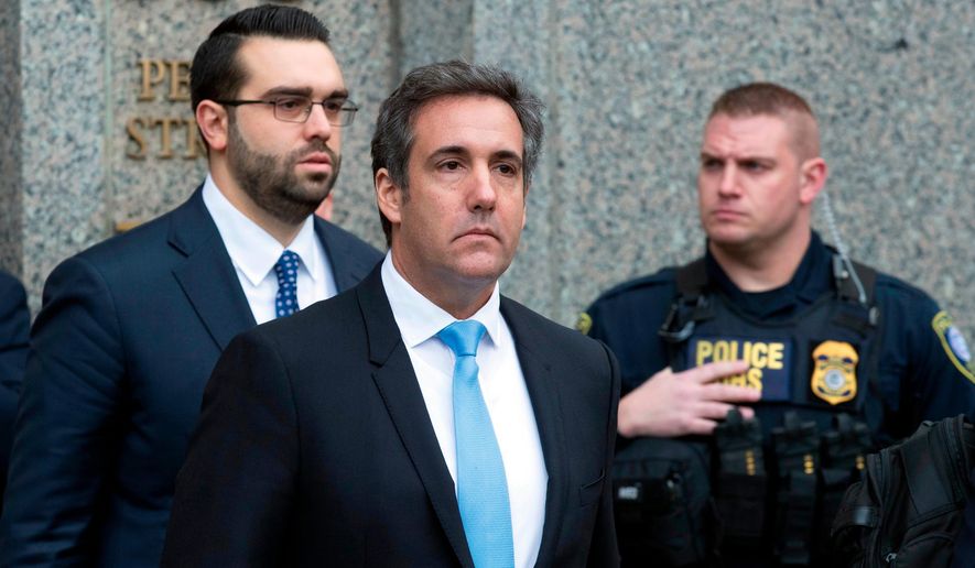 In a Monday, April 16, 2018, file photo, Michael Cohen, President Donald Trump&#x27;s personal attorney, center, leaves federal court, in New York. (AP Photo/Mary Altaffer, File)