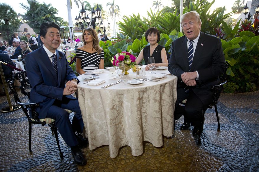 President Donald Trump, first lady Melania Trump, sit with Japanese Prime Minister Shinzo Abe and his wife Akie Abe before dinner Trump&#x27;s private Mar-a-Lago club, Tuesday, April 17, 2018, in Palm Beach, Fla. (AP Photo/Pablo Martinez Monsivais)