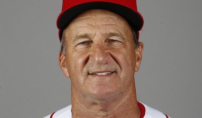 This is a 2018 file photo showing bench coach Jim Riggleman of the Cincinnati Reds baseball team, in Goodyear, Ariz. The Reds fired Bryan Price on Thursday, April 19, 2018, after their 3-15 start, the first managerial change in the major leagues this season. Riggleman will manage the team on an interim basis.  (AP Photo/Ross D. Franklin)
