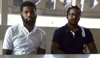 Rashon Nelson, left, and Donte Robinson, right, both 23, sit in their attorney&#39;s conference room as they pose for a portrait following an interview with The Associated Press Wednesday April 18, 2018 in Philadelphia. Their arrests at a local Starbucks quickly became a viral video and galvanized people around the country who saw the incident as modern-day racism. In the week since, Nelson and Robinson have met with Starbucks CEO Kevin Johnson and are pushing for lasting changes to ensure that what happened to them doesn&#39;t happen to future patrons. They are also still processing what it means to have had an everyday encounter escalate into a police confrontation. (AP Photo/Jacqueline Larma)