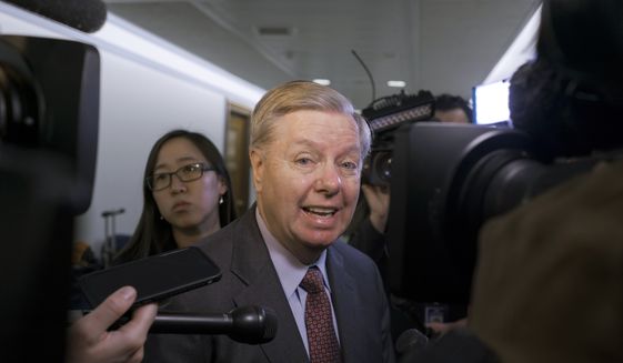 Sen. Lindsey Graham, R-S.C., a member of the Senate Judiciary Committee is questioned by reporters as he arrives for the panel to consider a bipartisan bill he introduced to protect special counsel Robert Mueller&#39;s job, on Capitol Hill in Washington, Thursday, April 19, 2018. (AP Photo/J. Scott Applewhite) ** FILE **