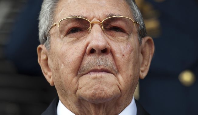 In this March 17, 2015, file photo, Cuba&#x27;s President Raul Castro listens to the playing of national anthems during his welcome ceremony at the Miraflores presidential palace in Caracas, Venezuela. On April 19, 2018, Raul Castro will step down as president after a decade in office. (AP Photo/Ariana Cubillos, File)