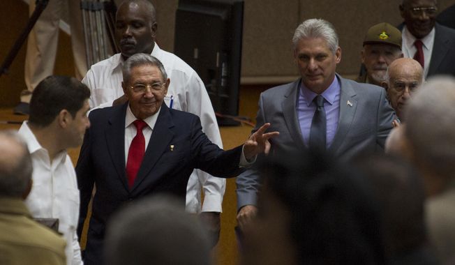 In this photo released by Cuba&#x27;s state-run media Cubadebate, Cuba&#x27;s President Raul Castro, center left, enters the National Assembly followed by his successor Miguel Diaz-Canel, center right, for the start of two-day legislative session in Havana, Cuba, Wednesday, April 18, 2018. The Cuban assembly selected the 57-year-old First Vice President as the sole candidate to succeed Castro on Wednesday, in a transition aimed at ensuring that the country&#x27;s single-party system outlasts the aging revolutionaries who created it. (Irene Perez/Cubadebate via AP)