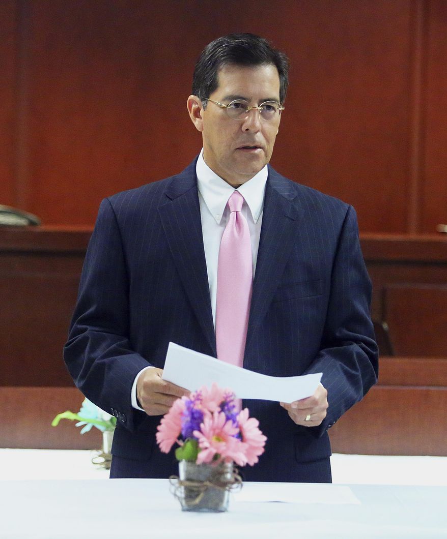 In a Wednesday, March 28, 2018 photo, County Court-at-Law Judge Rodolfo "Rudy" Gonzalez speaks during the first graduation ceremony for the county's Domestic Violence Court, at the Hidalgo County Courthouse in Edinburg, Texas. Offenders who committed a misdemeanor assault on a spouse or partner were given the opportunity to attend a year-long program and have their case dismisses upon graduation. (Joel Martinez/The Monitor via AP)