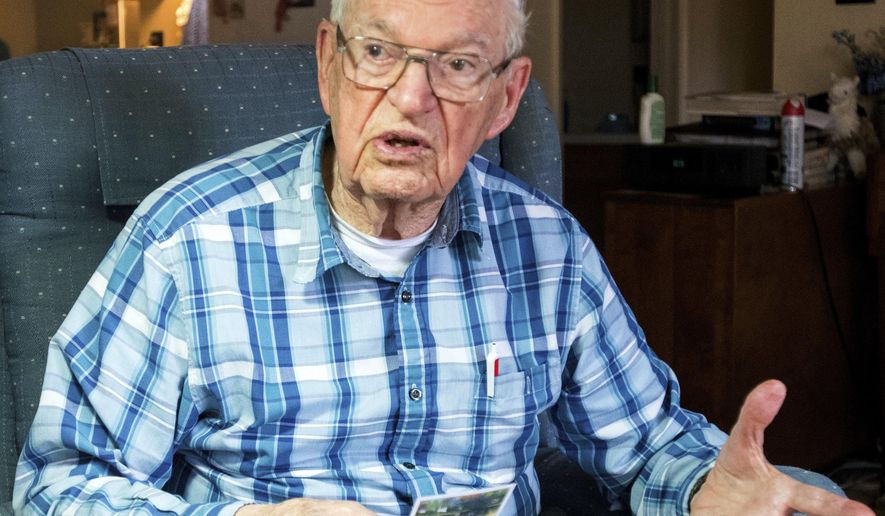 In this April 3, 2018, photo, Fred Finn, 94, talks about serving in World War II in Okinawa at his home in Monticello, Ill. Finn built roads and landing strips on the island of Okinawa, where Japanese snipers were plentiful. In World War II in Okinawa, the Seabees, Navy engineers and construction workers, were tasked to repair or build infrastructure for Marine and Army personnel.(Robin Scholz/The News-Gazette via AP )