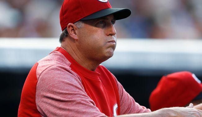 FILE - In this July 5, 2017, file photo, Cincinnati Reds manager Bryan Price reacts after starting pitcher Scott Feldman walks Colorado Rockies&#x27; Carlos Gonzalez to put two runners on base in the first inning of a baseball game, in Denver. The Reds have fired Bryan Price after a 3-15 start, the first managerial change in the major leagues this season. Price was in his fifth season leading the rebuilding team. The Reds have lost at least 94 games in each of the last three seasons while finishing last in the NL Central. Bench coach Jim Riggleman will manage the team on an interim basis. (AP Photo/David Zalubowski, File)