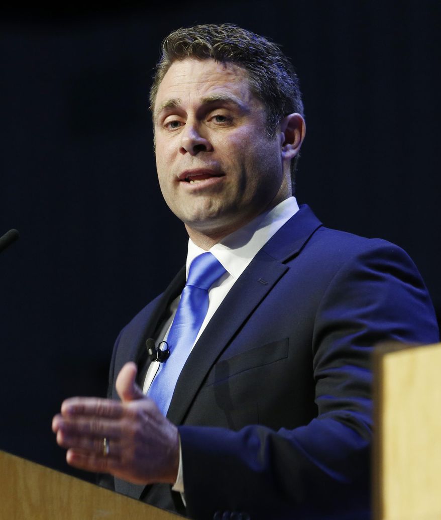 Republican primary senatorial candidate Del. Nick Freitas, gestures during a debate with E. W. Jackson, and Corey Stewart at Liberty University in Lynchburg, Va., Thursday, April 19, 2018. (AP Photo/Steve Helber)