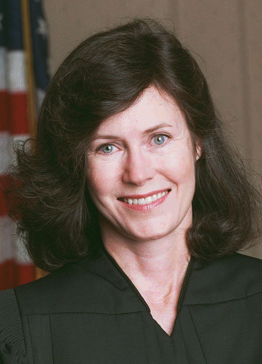 FILE - In this 1994 file photo, U.S. judge Kimba Wood poses for a portrait. Sometimes it takes a colorful judge like no other to handle a colorful case like no other. Wood, who once seemed the favorite to become the nation's first female attorney general, is refereeing a legal fight over records seized by the FBI from President Donald Trump's personal lawyer. (Bruce Gilbert/Newsday via AP)