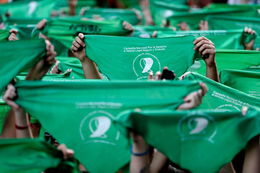 Green handkerchiefs have become a near-ubiquitous symbol for the cause of legalized abortion in Argentina. (Associated Press/File)