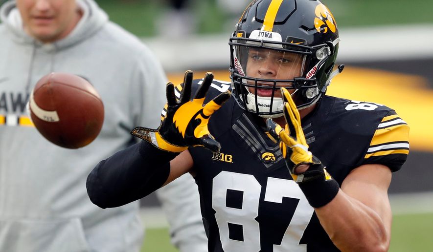Iowa tight end Noah Fant catches a pass during a drill before the team's NCAA college football spring scrimmage, Friday, April 20, 2018, in Iowa City, Iowa. (AP Photo/Charlie Neibergall)