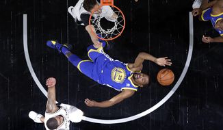 Golden State Warriors&#x27; Kevin Durant (35) is thrown back attempting to score against San Antonio Spurs&#x27; Pau Gasol, top, and forward LaMarcus Aldridge, bottom, during the second half of Game 3 of a first-round NBA basketball playoff series in San Antonio, Thursday, April 19, 2018. (AP Photo/Eric Gay)
