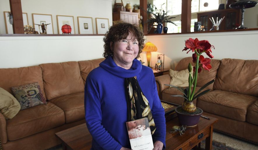 This April 9, 2018 photo shows Deb Newell in her home in Lakeside, Mont. Newell purchased the book "My Lobotomy" at the West Shore Community Library. The book led Newell to reconnect with the author of the book Howard Dully, whom she had been childhood friends with. (Brenda Ahearn/The Daily Inter Lake via AP)