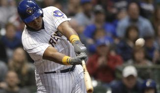 Milwaukee Brewers&#39; Jesus Aguilar hits a walk-off home run during the ninth inning of the team&#39;s baseball game against the Miami Marlins on Saturday, April 21, 2018, in Milwaukee. The Brewers won 6-5. (AP Photo/Aaron Gash)