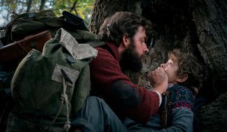 This image released by Paramount Pictures shows John Krasinski, left, and Noah Jupe in a scene from &amp;quot;A Quiet Place.&amp;quot; (Jonny Cournoyer/Paramount Pictures via AP)
