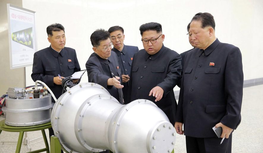 FILE - This undated file photo distributed on Sept. 3, 2017 by the North Korean government, shows North Korean leader Kim Jong Un, second from right, at an undisclosed location in North Korea. When North Korean leader Kim Jong Un meets South Korean President Moon Jae-in on Friday, April 27, 2018,  the world will have a single overriding interest: How will they address North Korea’s decades-long pursuit of nuclear-armed missiles? Success, even a small one, on the nuclear front could mean a prolonged detente and smooth the path for a planned summit between Kim and President Donald Trump in May or June. Optimists hope that the two summits might even result in a grand nuclear bargain. (Korean Central News Agency/Korea News Service via AP, File)