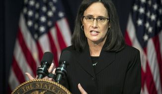 Illinois Attorney General Lisa Madigan outlines a federal lawsuit her office filed against Champaign, Ill.-based Suburban Express Inc., and owner Dennis Toeppen accusing it of discriminating and harassing customers and their families during a news conference in Chicago, Monday, April 23, 2018. The transportation company provides bus service to college students in Illinois, Iowa and Indiana to the Chicago area. (Ashlee Rezin/Chicago Sun-Times via AP)