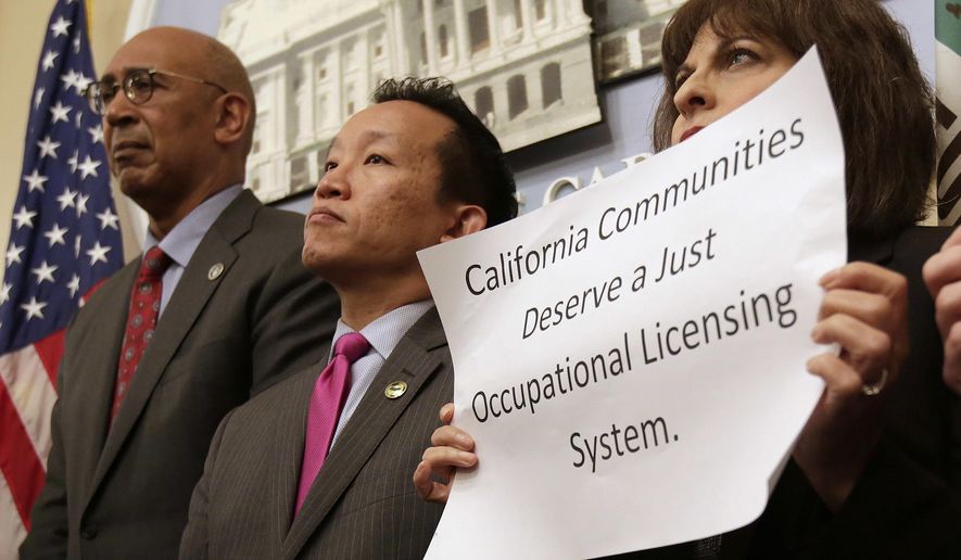 Assemblyman Chris Holden, D-Pasadena, left, and Assemblyman David Chiu, D-San Francisco, center, listen as proponents speak in support of their bills that would generally bar state agencies from denying licenses to an applicant because of prior arrests or convictions for nonviolent offenses, during a news conference, Monday, April 23, 2018, in Sacramento, Calif. Advocates say, that if approved by the Legislature and signed by the governor, the measures could help nearly eight million Californians get licenses so they could work jobs including barbers, cosmetologists, ambulance attendants or providing care to the elderly, ill or those with disabilities. At right is Rebecca Gonzales, of the National Association of Social Workers, who supports that bills. (AP Photo/Rich Pedroncelli)