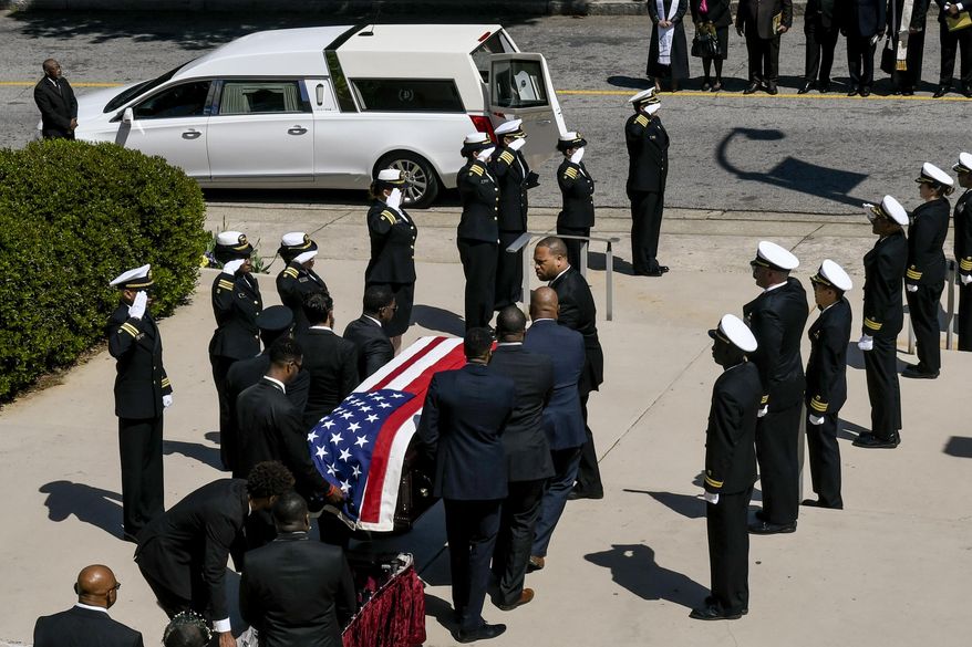 A casket bearing CDC researcher Timothy Cunningham is carried past a CDC honor guard during a memorial service held at Morehouse College Saturday, April 21, 2018, in Atlanta. Cunningham was found drowned in the Chattahoochee River after going missing for seven weeks however a medical examiner found no evidence of foul play. (John Amis/Atlanta Journal-Constitution via AP)