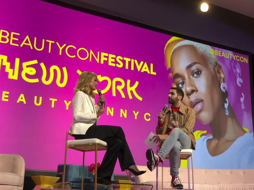 This April 21, 2018 photo shows Paris Hilton, left, appears with moderator Phillip Picardi during the beauty industry event Beautycon Festival NYC in New York. Hilton said that she regrets saying pre-election that women who accused President Donald Trump of sexual misconduct were merely after fame and attention. (AP Photo/Leanne Italie)