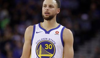 FILE - This March 6, 2018 file photo shows Golden State Warriors guard Stephen Curry during an NBA basketball game against the Brooklyn Nets in Oakland, Calif.  Sony Pictures Entertainment announced Monday, April 23, that it has struck a deal with the Golden State Warriors All-Star guard to produce television, film and possibly gaming projects. (AP Photo/Jeff Chiu, File)