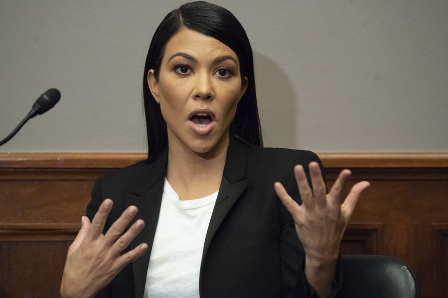 Kourtney Kardashian, a reality television personality and fashion and glamour entrepreneur, attends a news conference in support of personal care products legislation, the Personal Care Products Safety Act, introduced a year ago, on Capitol Hill in Washington, Tuesday, April 24, 2018. The bill, sponsored by Sen. Dianne Feinstein, D-Calif., and Sen. Susan Collins, R-Maine, seeks to amend the Federal Food, Drug, and Cosmetic Act and provide enhanced oversight on cosmetics and personal care products. (AP Photo/J. Scott Applewhite) At left is Environmental Working Group President Ken Cook