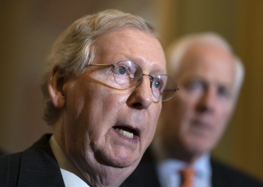Senate Majority Leader Mitch McConnell, R-Ky., joined by, Majority Whip John Cornyn, R-Texas, speaks with reporters following a closed-door strategy session on Capitol Hill in Washington, Tuesday, April 24, 2018. (AP Photo/J. Scott Applewhite) ** FILE **