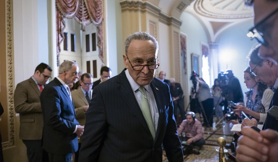 Senate Minority Leader Chuck Schumer, D-N.Y., turns to confer with an aide during a news conference where he talked about the confirmation battle over President Donald Trump&#x27;s nominee for secretary of state, Mike Pompeo, on Capitol Hill in Washington, Tuesday, April 24, 2018. (AP Photo/J. Scott Applewhite)