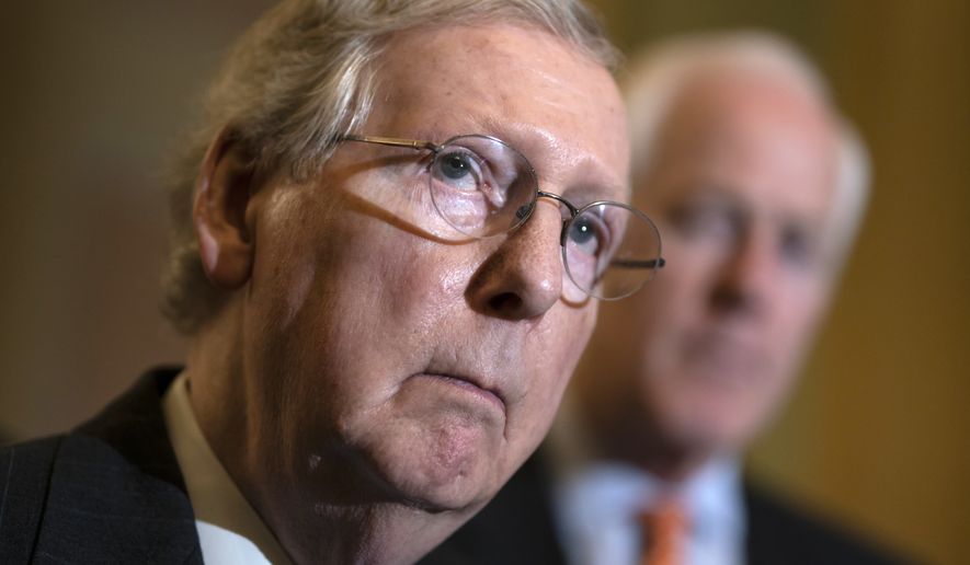 Senate Majority Leader Mitch McConnell, R-Ky., joined by, Majority Whip John Cornyn, R-Texas, speaks with reporters following a closed-door strategy session on Capitol Hill in Washington, Tuesday, April 24, 2018. McConnell urged confirmation for President Donald Trump&#x27;s nominee for secretary of state, Mike Pompeo, but have indefinitely delayed the confirmation hearing for the president&#x27;s pick to be Veterans Affairs secretary, Rear Adm. Ronny Jackson. (AP Photo/J. Scott Applewhite)