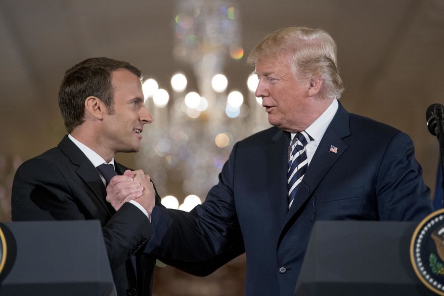 President Donald Trump and French President Emmanuel Macron shake hands during a joint news conference in the East Room of the White House in Washington, Tuesday, April 24, 2018. (AP Photo/Andrew Harnik)