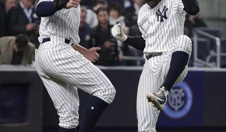 New York Yankees&#39; Didi Gregorius, right, celebrates with Aaron Judge after hitting Gregorius hit two-run home run against the Minnesota Twins during the fifth inning of a baseball game Tuesday, April 24, 2018, in New York. (AP Photo/Julie Jacobson)