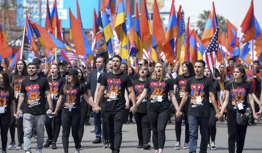 Thousands attend a march in Hollywood, Calif., on Tuesday, April 24, 2018, to commemorate the 103rd anniversary of the Armenian Genocide.  (David Crane/Los Angeles Daily News via AP)