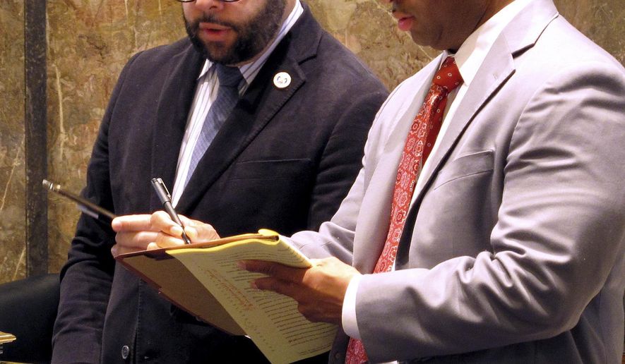 FILE -In this March 9, 2016 file photo, state Sen. J.P. Morrell, left, a Democrat who chairs the Senate tax committee, talks with a Senate staff member on the final day of the special legislative session on the budget and taxes in Baton Rouge, La. Morrell's effort to strengthen anti-bestiality laws is facing unlikely opposition from lawmakers who see it as an underhanded move to strike the state's unconstitutional ban on sodomy. Opponents say current law in Louisiana is fine. (AP Photo/Melinda Deslatte, File)
