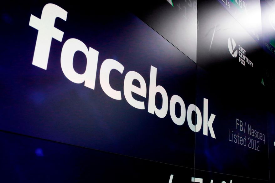 FILE - In this March 29, 2018, file photo, the logo for Facebook appears on screens at the Nasdaq MarketSite in New York's Times Square. For the first time, Facebook is making public, on Tuesday, April 24, its detailed guidelines for determining what it will and won’t allow on its service. (AP Photo/Richard Drew, File)